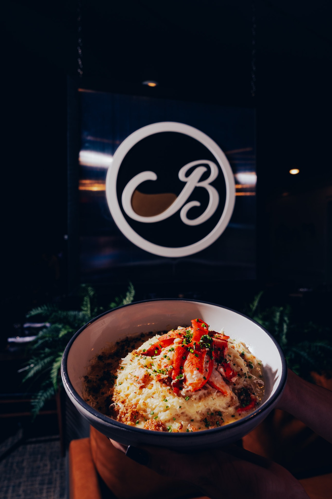 Lobster pasta in front of the White Wine & Butter sign, restaurants in Greer SC